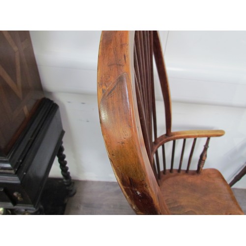 7591 - A pair of circa 1800 his and hers Windsor chairs, the hoop and stick-back over a solid elm seat, on ... 