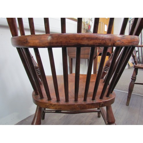 7591 - A pair of circa 1800 his and hers Windsor chairs, the hoop and stick-back over a solid elm seat, on ... 