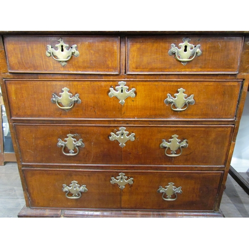 7604 - An 18th Century walnut diminutive chest of two short over three long drawers, brass handles and fret... 