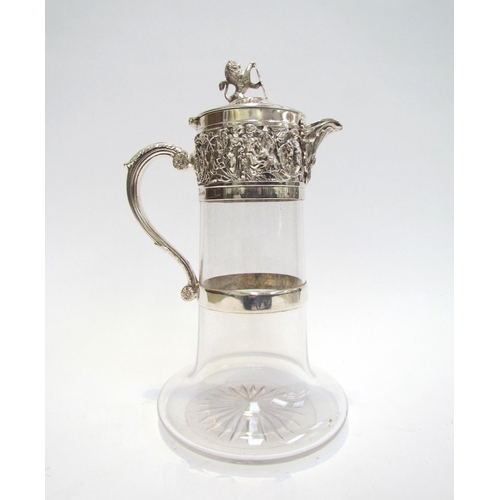 7609A - A Hukin & Heath silver plated glass carafe with border of cherubs and putti playing, lion and shield... 