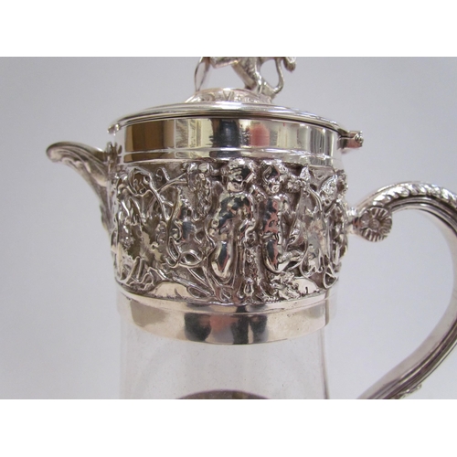 7609A - A Hukin & Heath silver plated glass carafe with border of cherubs and putti playing, lion and shield... 