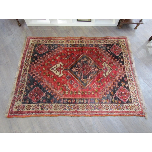 7610 - A Persian hand knotted wool rug, red ground with birds and floral borders, 155cm x 115cm