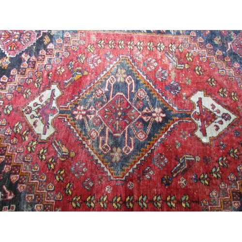 7610 - A Persian hand knotted wool rug, red ground with birds and floral borders, 155cm x 115cm