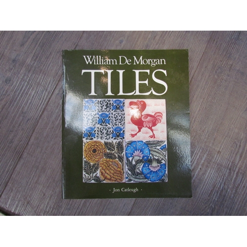 7503 - A collection of Victorian tiles together with a book on William De Morgan tiles