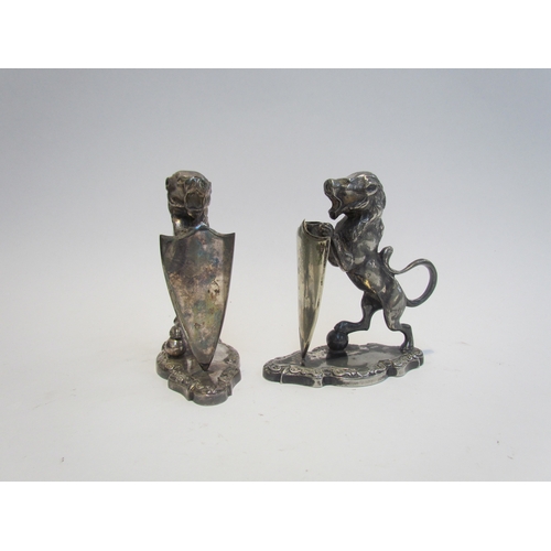 7631 - A pair of Walker & Hall silver plated lions with shields, stamped 17044 to base, each 12.5cm tall