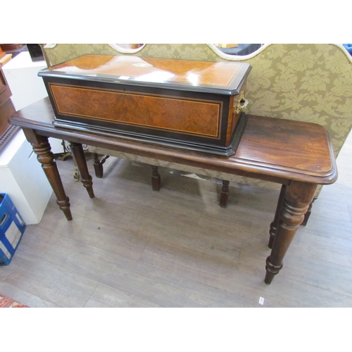 7645 - A reproduction mahogany console table, round-cornered top over turned supports, 157cm x 86cm x 46cm ... 