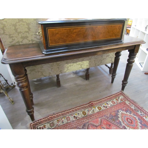 7645 - A reproduction mahogany console table, round-cornered top over turned supports, 157cm x 86cm x 46cm ... 