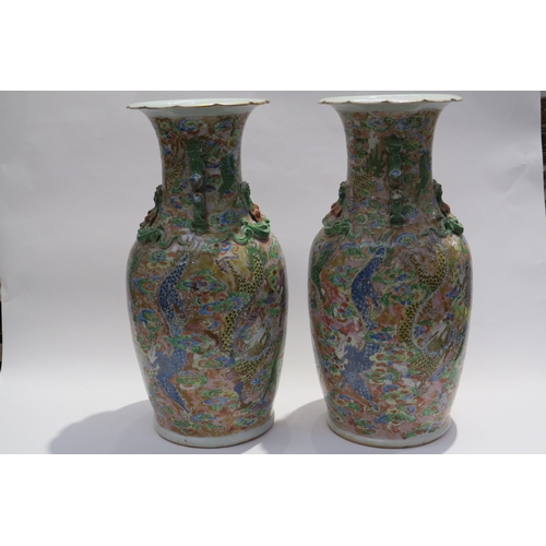 7232 - WITHDRAWN: A pair of 19th Century Chinese famille rose Canton vases, the frilled lip over  tapering ... 