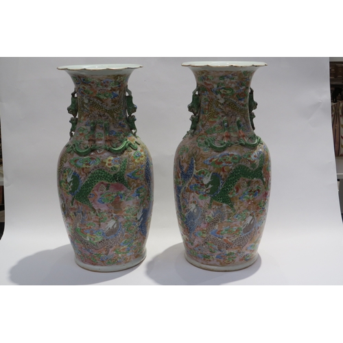 7232 - WITHDRAWN: A pair of 19th Century Chinese famille rose Canton vases, the frilled lip over  tapering ... 