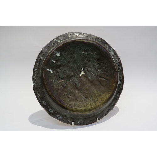 7235 - An 18th Century embossed brass Adam & Eve biblical charger/Alms dish, 30cm diameter