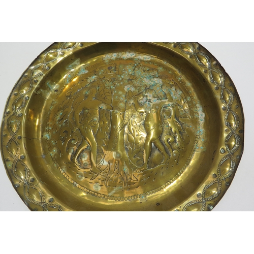 7235 - An 18th Century embossed brass Adam & Eve biblical charger/Alms dish, 30cm diameter