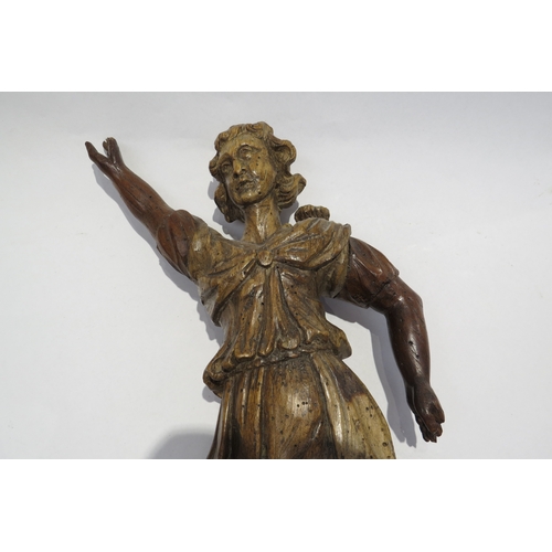 7238 - A 17th Century carved fruit wood female figure with hand aloft, elements maybe missing from back, wo... 