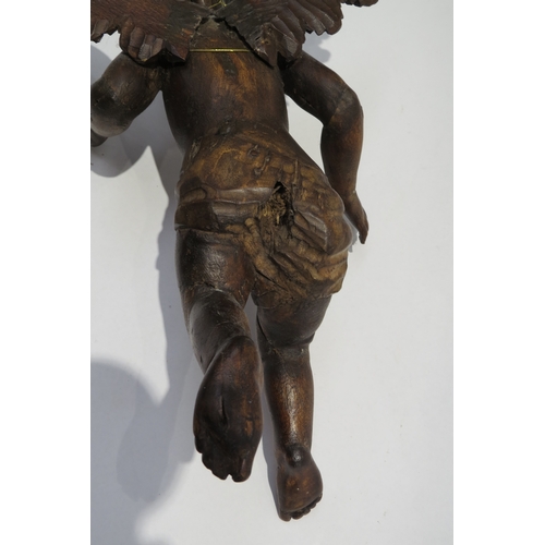 7239 - A 19th Century fruitwood angel figure, damage to fingers, 35.5cm tall, 27.5cm wide, 16cm deep