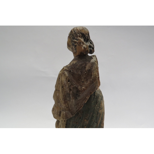 7240 - A 17th Century European carved lime wood figure of a saint in a time worn state mounted on a marble ... 