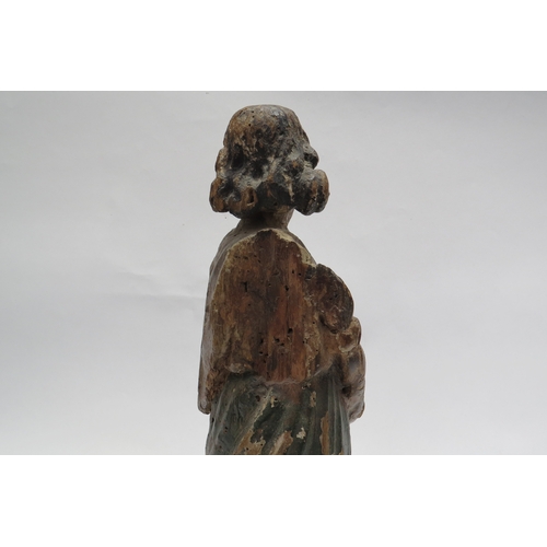 7240 - A 17th Century European carved lime wood figure of a saint in a time worn state mounted on a marble ... 