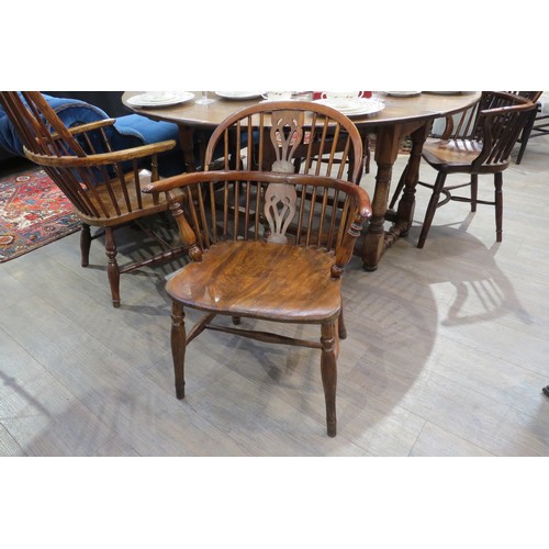 7754 - A 19th Century elm hoop back Windsor chair, H stretcher base   (R) £200