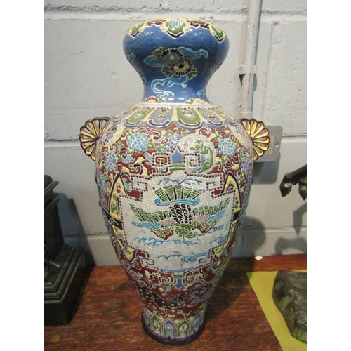 1058 - A pair of Oriental vases decorated in enamels, fan handles, mythical creatures, one heavily restored... 