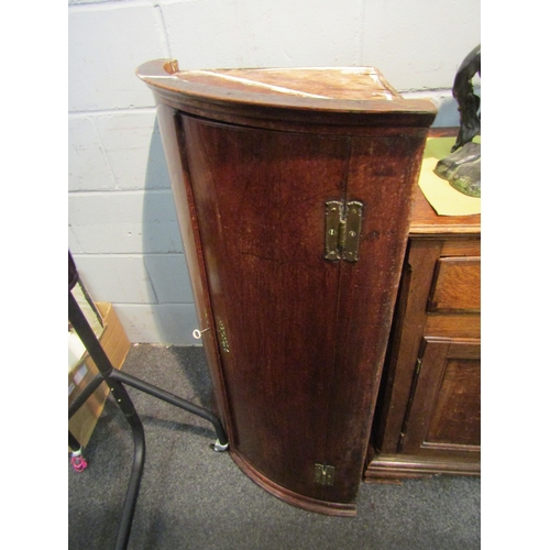 1063 - A Georgian oak corner cupboard, shelved interior, 105cm tall x 70cm wide x 50cm deep