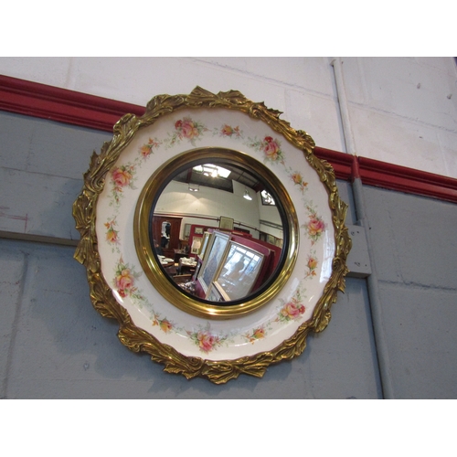 1085 - A convex circular wall mirror in Royal Staffordshire pottery and brass frame, 48cm diameter    (R) £... 