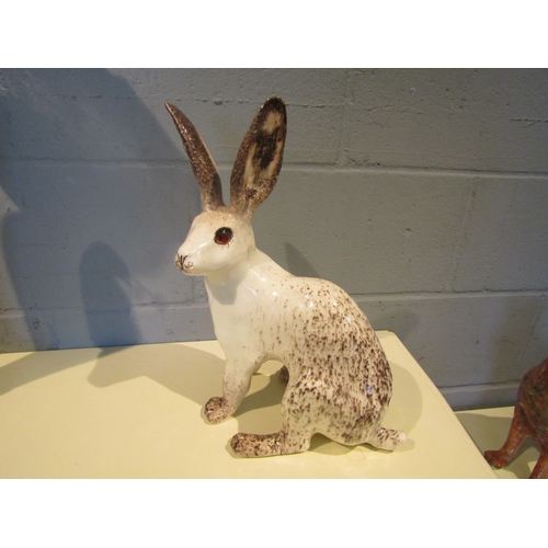 1090 - A Winstanley figure of a white Hare, restored foot, 39.5cm tall