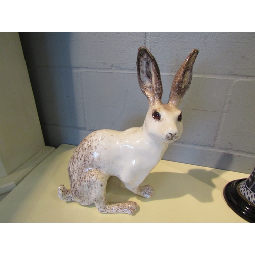 1092 - A Winstanley figure of a white Hare, foot restored, 27.5cm tall