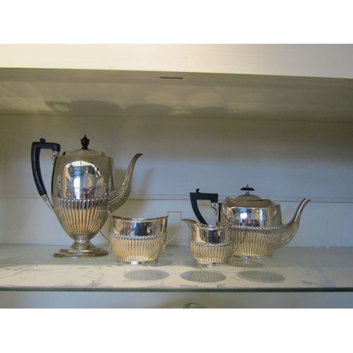 1095 - An associated four piece EPNS tea and coffee set, ebony knop and handless