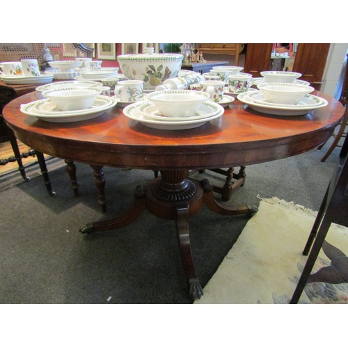 1118 - A Victorian mahogany breakfast/loo tilt-top table raised on turned melon fluted column, platform inl... 