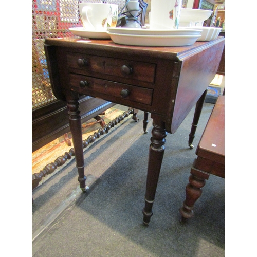 1122 - A 19th Century  mahogany Sutherland table, two single drawers and two dummy drawers, raised on turne... 