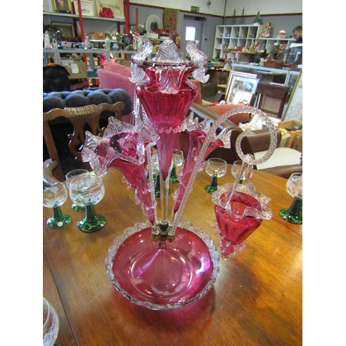 1172 - A Victorian cranberry glass epergne centrepiece, three epergnes and two hanging baskets   (E) £60-10... 