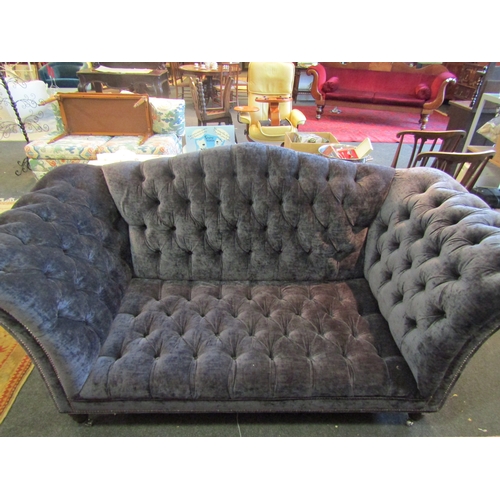 1178 - A Victorian style blue buttoned sofa