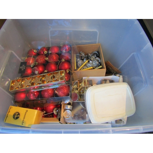 1196 - A plastic container and box of Christmas decorations including red baubles, nightlight holders, etc