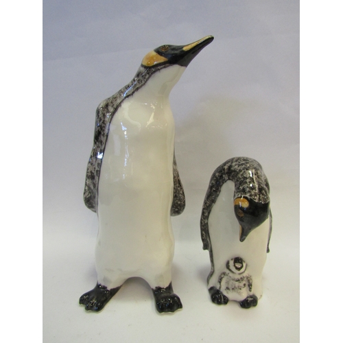 1225 - A Winstanley figure of a Penguin, 28cm tall, and another Penguin with chick at her feet, 16cm tall  ... 