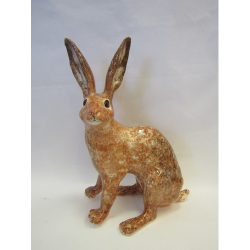 1226 - A Winstanley figure of a brown Hare, restored leg, 38cm tall