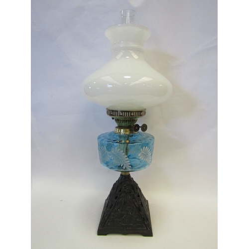 1227 - A Victorian oil lamp, opaque shade, turquoise sump overpainted with fern, a mixed metal table lamp, ... 