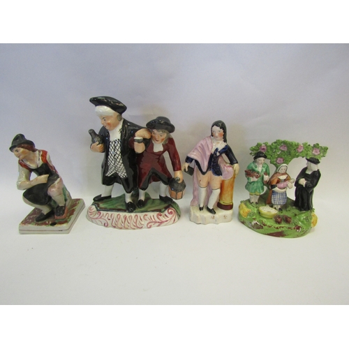 1228 - Four various 19th Century Staffordshire figural groups to include a pair of drunken gentlemen, poet,... 