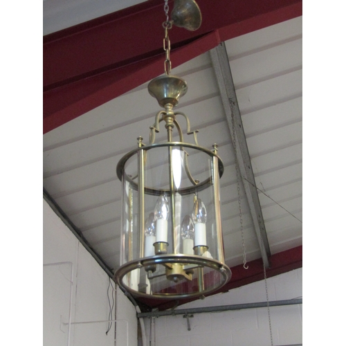 1243 - A pair of Georgian style brass pendant lights with curved glass shades   (R) £150