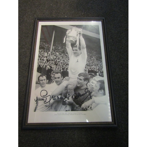 1261 - A framed and glazed photographic print of Tottenham Hotspur after winning the 1967 FA Cup final, rep... 