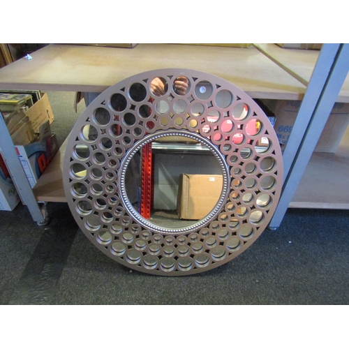 1287 - A circular mirror with beaded and roundel silver coloured frame, 63cm diameter  (R)  £10-15