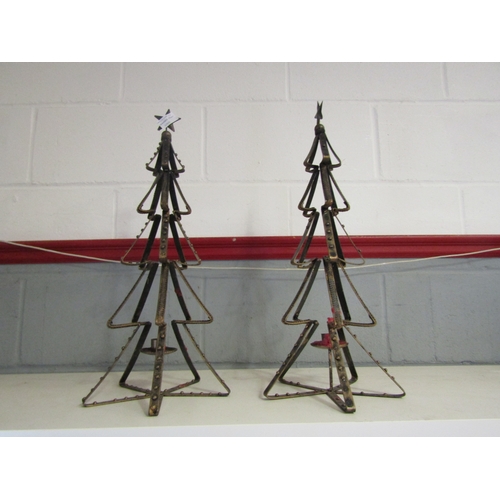 1298 - A pair of Christmas tree form candle stands, 54cm tall