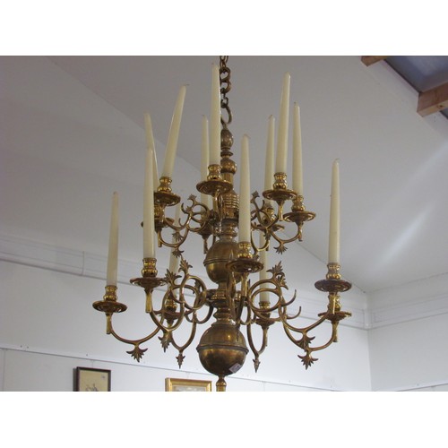 7184 - A brass two tier 12 sconce candelabra