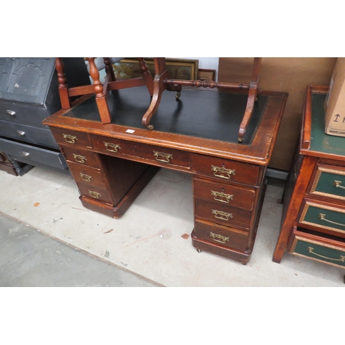 2382 - A 20th Century twin pedestal desk with a leather insert top and brass handles