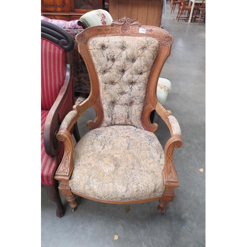 2409 - A Victorian oak framed open armchair