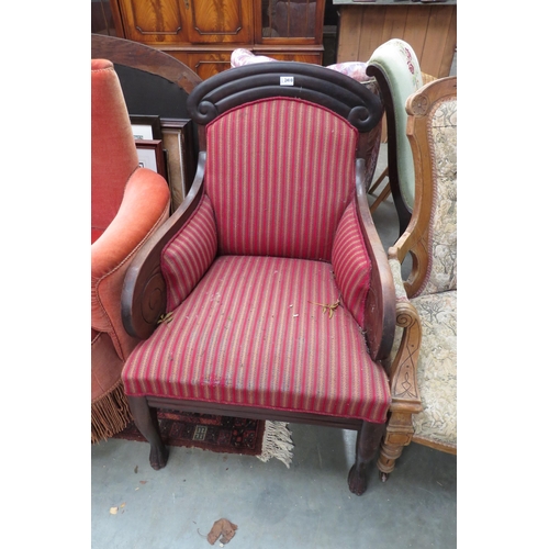 2410 - A late 19th Century mahogany framed scroll armchair on paw feet       (E) £10-15