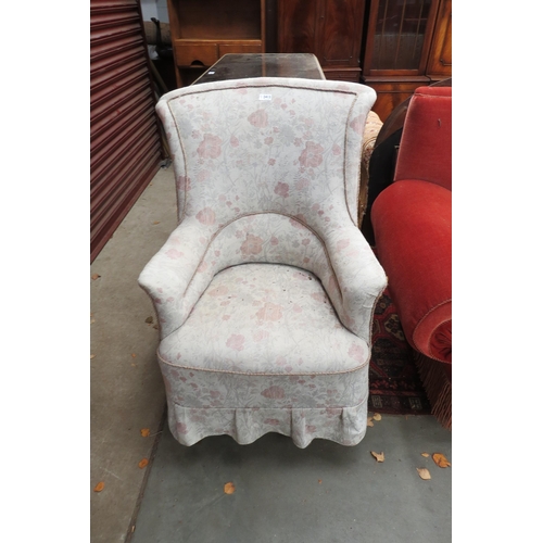 2413 - A 1930's oak armchair on turned front legs        (E) £10-15