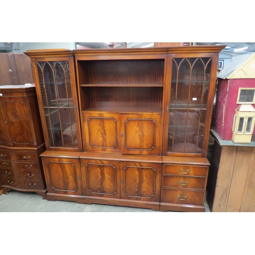 2420 - A Georgian style mahogany three section wall unit with drinks cabinet centre flanked with side cabin... 