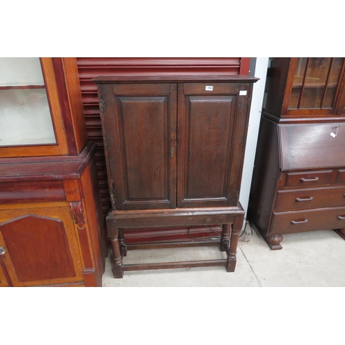 2366 - A small Georgian later oak country house cupboard on stand      (E) £40-60