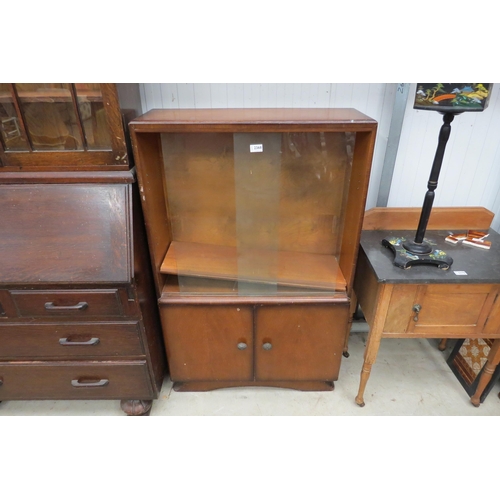 2368 - A 1950's oak and glazed bookcase and a coffee table