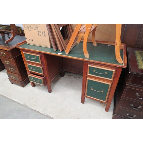 2385 - A mid 20th Century twin pedestal desk with green surface and drawer fronts