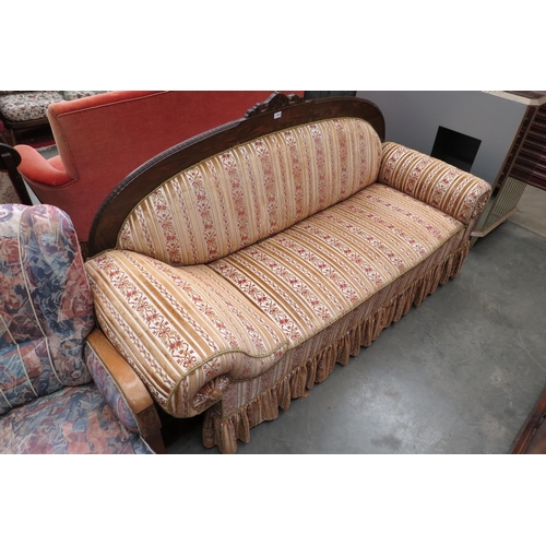 2415 - A Victorian mahogany scroll end day bed sofa with floral ribbon upholstery