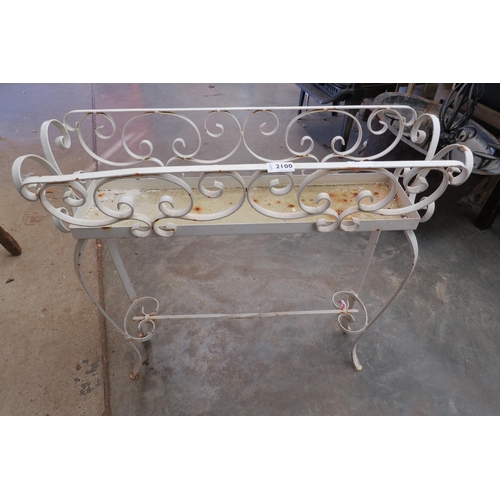 2100 - A 1950's wrought iron planter on scrolled legs